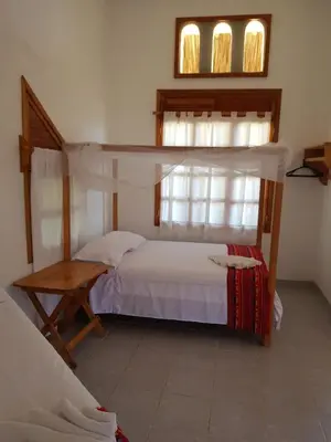 Cama o camas de una habitación en El Eden Bungalows