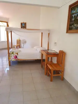 Cama o camas de una habitación en El Eden Bungalows