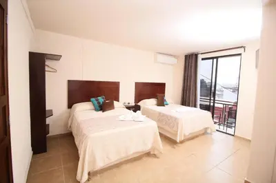 Cama o camas de una habitación en Hotel Sacre