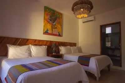 Cama o camas de una habitación en NaNa Vida Hotel Oaxaca