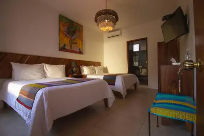 Cama o camas de una habitación en NaNa Vida Hotel Oaxaca