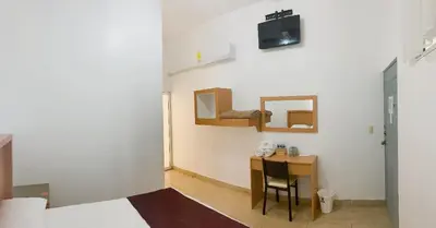 Una televisión o centro de entretenimiento en Hotel Terrazas Inn