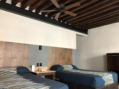 Cama o camas de una habitación en Hotel Frida