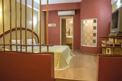Una televisión o centro de entretenimiento en Autohotel Ilussion