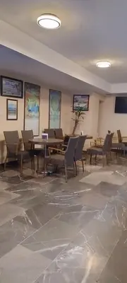 Una televisión o centro de entretenimiento en Hotel Bello Cordoba