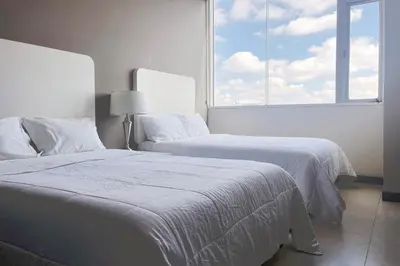 Cama o camas de una habitación en Laviu B&B Luxe Suites