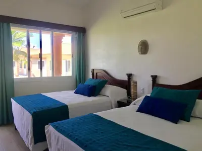 Cama o camas de una habitación en Ananta Hotel