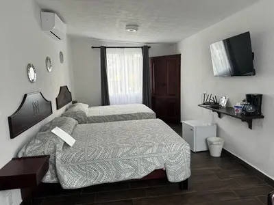 Cama o camas de una habitación en Ananta Hotel