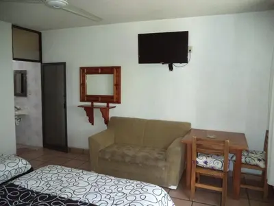 Una televisión o centro de entretenimiento en Hotel Ocampo