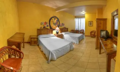 Cama o camas de una habitación en Hotel Posada Catarina