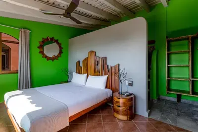 Cama o camas de una habitación en Suites La Hacienda
