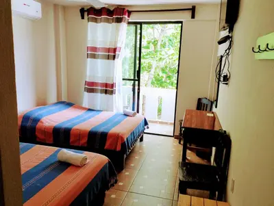 Cama o camas de una habitación en Yuu-Lee Casa Bendita Huatulco