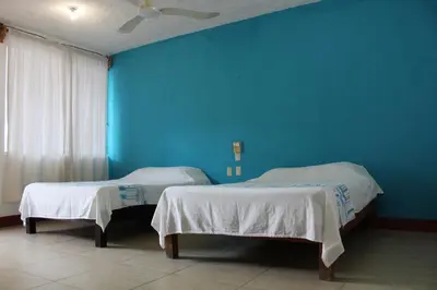 Cama o camas de una habitación en Hotel Carruiz
