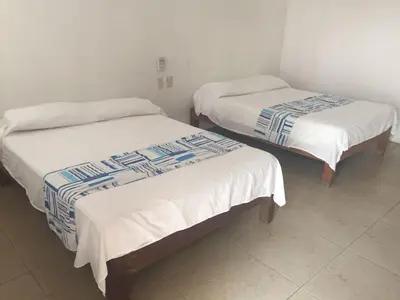 Cama o camas de una habitación en Hotel Carruiz