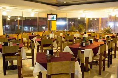 Un restaurante o sitio para comer en Hotel Enriquez