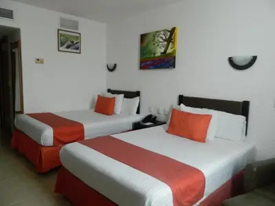 Cama o camas de una habitación en Hotel Enriquez