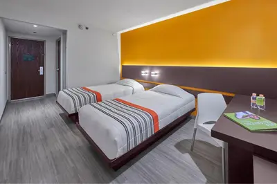 Cama o camas de una habitación en City Express Junior by Marriott Tuxtepec