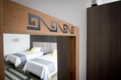 Cama o camas de una habitación en Maria Ines Hotel Suite