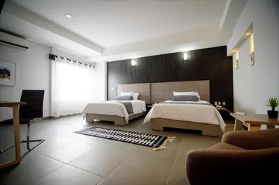 Cama o camas de una habitación en Maria Ines Hotel Suite
