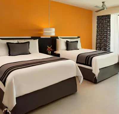 Cama o camas de una habitación en Dreams Huatulco Resort & Spa