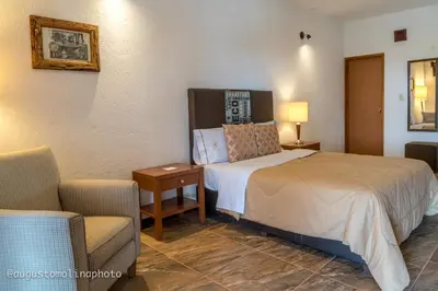 Cama o camas de una habitación en Hotel El Cristo