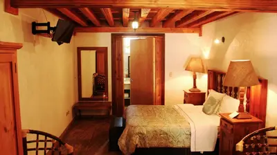 Cama o camas de una habitación en Hotel El Cristo