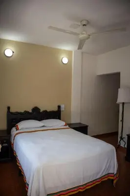 Cama o camas de una habitación en Hotel Casa Zoque Colonial