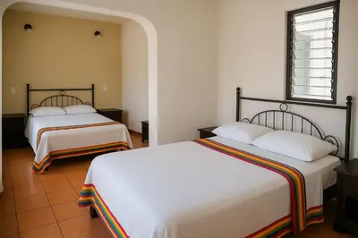 Cama o camas de una habitación en Hotel Casa Zoque Colonial