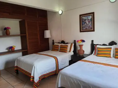 Cama o camas de una habitación en Hotel Casa Zoque Colonial
