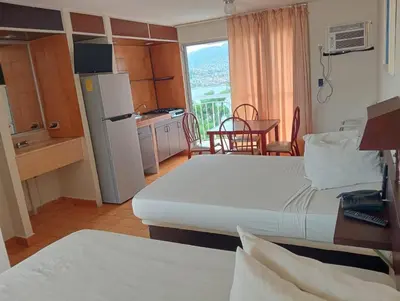 Cama o camas de una habitación en Alba Suites Acapulco