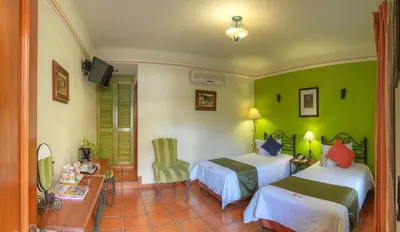 Cama o camas de una habitación en Hotel Boutique Parador San Miguel Oaxaca