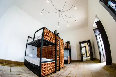Cama o camas de una habitación en Gente de Más Bnb
