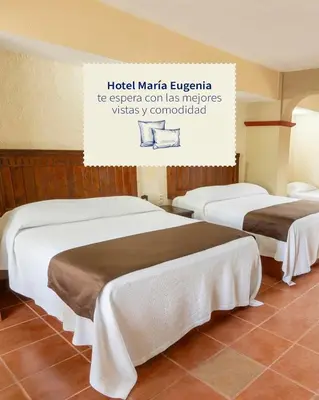 Cama o camas de una habitación en Hotel Hacienda María Eugenia Acapulco