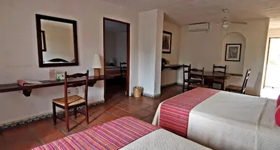 Cama o camas de una habitación en Villa Blanca Huatulco