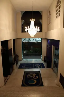 Una televisión o centro de entretenimiento en Hotel Clara Luna
