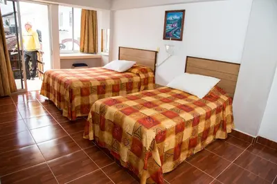 Cama o camas de una habitación en Hotel Symer