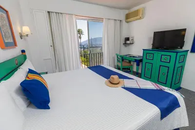 Cama o camas de una habitación en Hotel Victoria Oaxaca