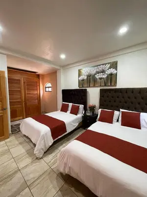 Cama o camas de una habitación en Hotel & Balneario Los Angeles