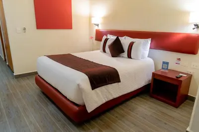 Cama o camas de una habitación en Mision Puebla Angelopolis