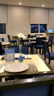 Un restaurante o sitio para comer en Mision Puebla Angelopolis