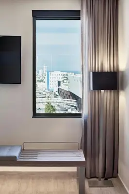 Una televisión o centro de entretenimiento en AC Hotel by Marriott Veracruz