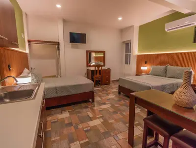 Una televisión o centro de entretenimiento en Casa Mayahuel