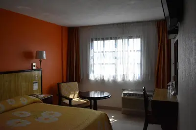 Cama o camas de una habitación en Hotel Baluarte
