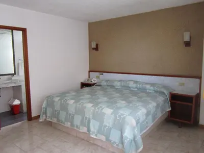 Cama o camas de una habitación en Hotel Baluarte