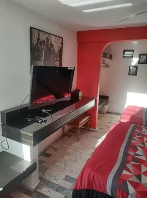Una televisión o centro de entretenimiento en Gal - Habitaciones Confortables