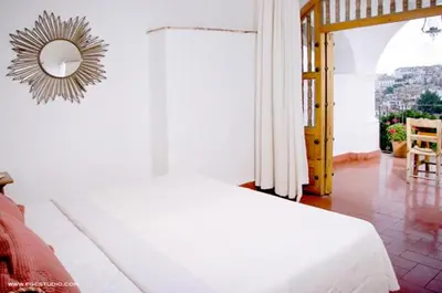 Cama o camas de una habitación en Posada de la Mision, Hotel Museo y Jardin