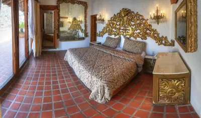 Cama o camas de una habitación en Posada de la Mision, Hotel Museo y Jardin
