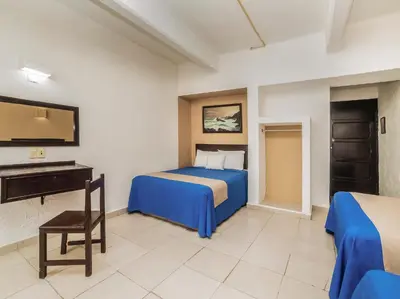 Cama o camas de una habitación en Hotel Trianon