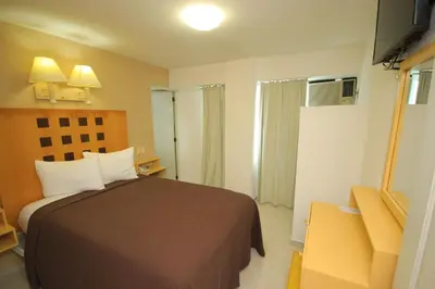 Cama o camas de una habitación en Hotel Posada del Carmen