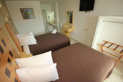 Cama o camas de una habitación en Hotel Posada del Carmen